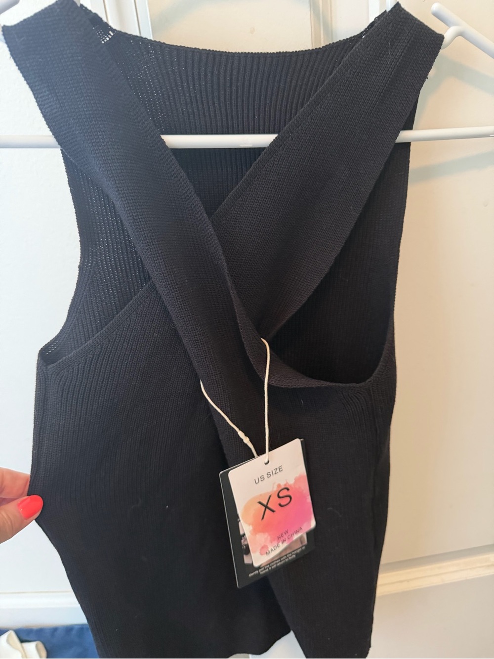 Classic Black Knit Sleeveless top with cross-cross back.